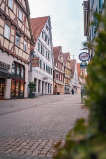 Malersische Altstadtstraße with half-timbered houses and shops, Herrenberg, Böblingen district,