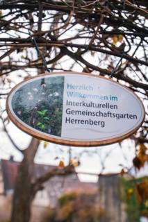 Wooden sign with a greeting in the Herrenberg intercultural community garden, Herrenberg, Böblingen