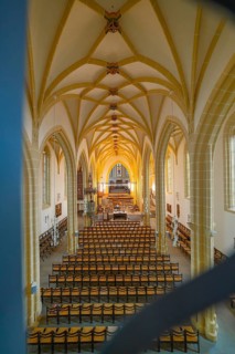 View of a church interior with altar and arranged seats, Gothic architecture, collegiate church,