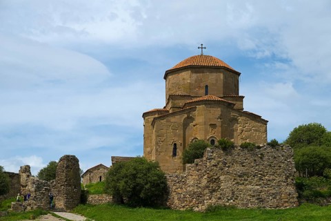 Historic church ruin with stone tower against a blue sky, Javari Monastery, Jvari Monastery,