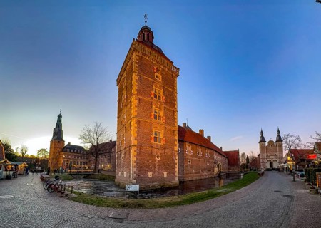 Panoramic photo in winter on winter evening from left on the edge of the picture Raesfeld Castle in