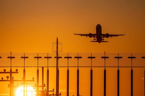 Runway lighting, approach aids, at Düsseldorf International airport, sunset, aviator taking off, in