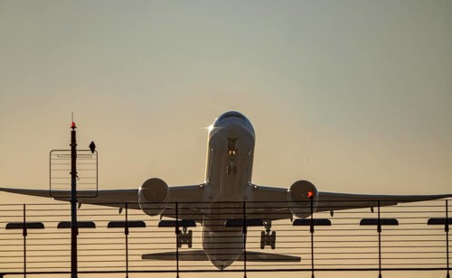 Runway lighting, approach aids, at Düsseldorf International Airport, sunset, aircraft taking off,