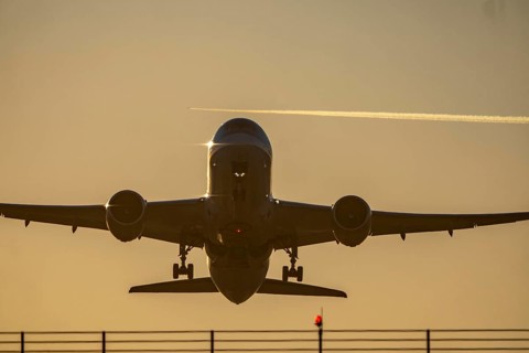 Runway lighting, approach aids, at Düsseldorf International Airport, sunset, aircraft taking off,