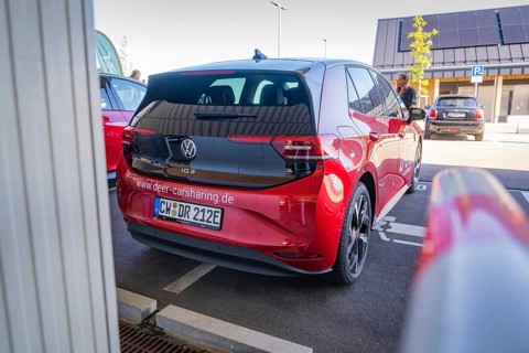 Red Volkswagen car sharing car in parking lot, modern design and urban environment, ID3, Deer e-