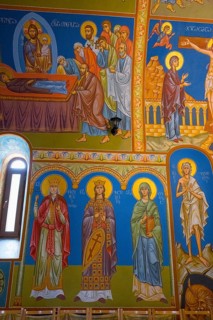 Detailed Orthodox frescoes depicting saints and religious scenes in vivid colors, St. Barbara