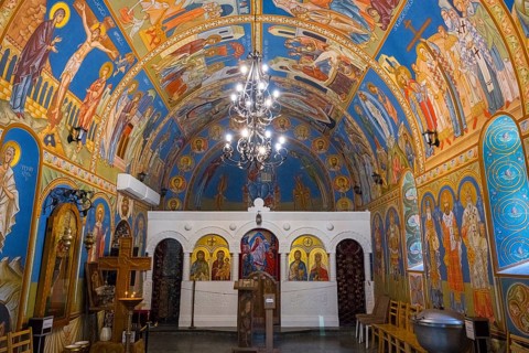 Beautifully painted Orthodox church with religious frescoes and spiritual atmosphere, St. Barbara