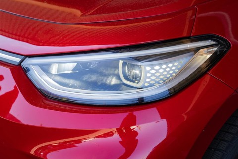 Red car light with modern headlight design in close-up, Deer E-Mobility Shuttle Service, Calw,