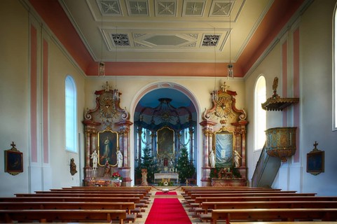 Interior view, nave and choir room, altar, Saint Barbara Catholic church from 1783, Christmas