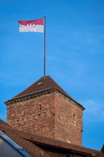 Waving Frankish flag on the Kaiserburg tower, Nuremberg, Middle Franconia, Bavaria, Germany