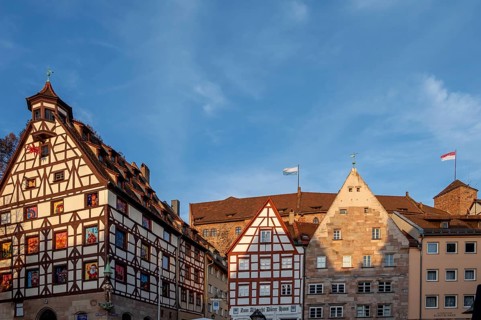 Historic Pilate House with Advent calendar, historical residential buildings on the right and the