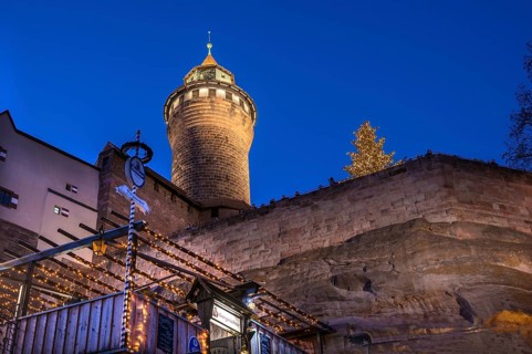 Illuminated Sinwell Tower, built in the 13th century, blue evening sky, Kaiserburg, Nuremberg,