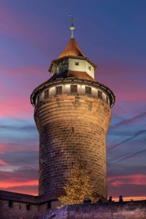 Illuminated Sinwell Tower, built in the 13th century, in the evening sky, Kaiserburg, Nuremberg,