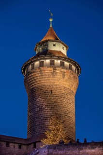 Sinwell tower illuminated in the evening, built in the 13th century, Kaiserburg, Nuremberg, Middle