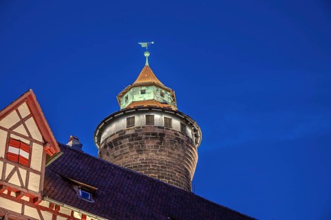 Sinwell Tower built in the 13th century, on the Nuremberg Kaiserburg in the evening lighting, blue