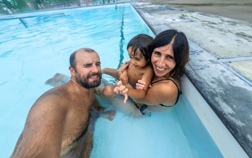 Happy family taking a selfie while enjoying a relaxing bath in the miette hot springs, located in