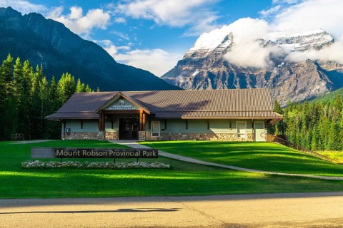 Mount robson provincial park welcome center building rising against majestic mountains and lush