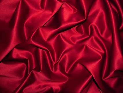 Elegant red satin with shiny shimmer and ornate wrinkles, clothing, background, velvety, solemn,