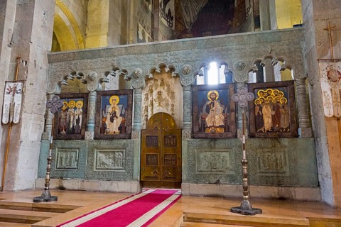 Altar of a church with impressive icons and wall paintings, Svetitskhoveli Cathedral,
