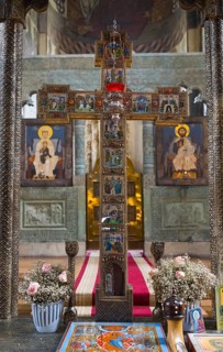 Magnificent decoration of a church altar with cross, icons and floral decorations, Svetitskhoveli