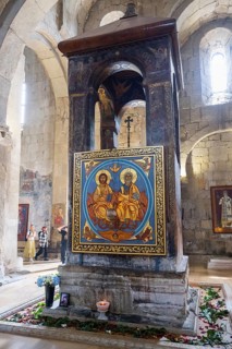 A decorative altar with large colorful icons and sacred art in a church, Svetitskhoveli Cathedral,