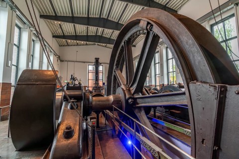 Large steel wheel of a steam engine in the coal world, Steinkohlebergbau Sachsen Museum, Oelsnitz