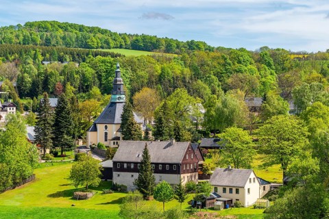 Residential buildings and landmarks of the historic mountain church, in the back forest, health