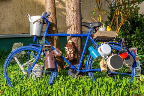 Blue painted bicycle with old pots and jugs, health resort and toy village Seiffen, Ore Mountains,