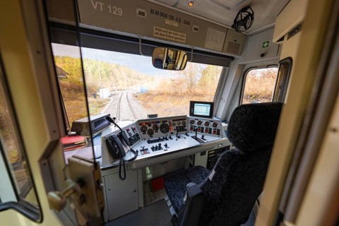 Driver's cab of a train with a view of the rails, technical instruments and control elements