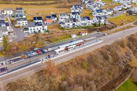 New residential development next to railway tracks in winter surroundings, historic event, first