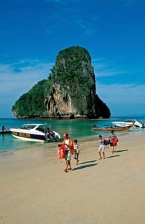 Rocks in the sea, boats and people on Pranang Cave beach, two years in front of the tsunami, Krabi,
