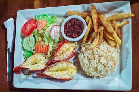 Plate of breaded shrimp with rice on the table with COPY SPACE, menu of breaded shrimp served on