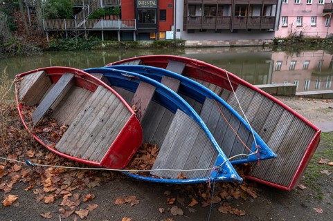Assembled rowing boats on the banks of Pegnitz, river in Nuremberg, Middle Franconia, Bavaria,