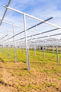 Empty metal frames on a field under a blue sky, Energiewende, construction of PV open space,