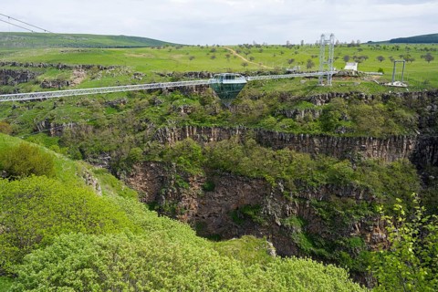 Landscape with bridge over deep gorge surrounded by green vegetation, diamond bridge, Diamond Glass