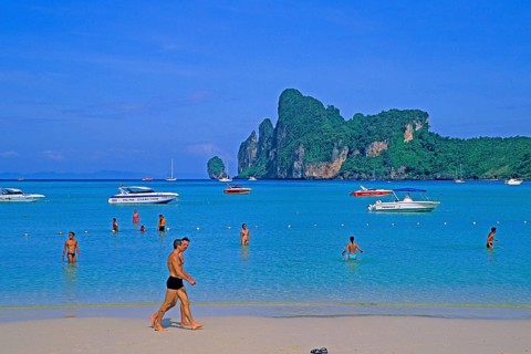 People, boats on the beach of Ko Phi Phi Don, two years in front of the tsunami, Thailand, December