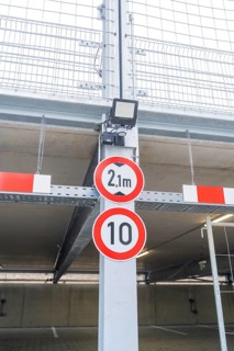 Traffic signs for height and speed restrictions in parking garages, parking garage construction