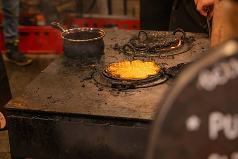Waffles are freshly prepared on a hot oven at a market stand, Weihnachtsmark Nagold, LandkreiScalw,