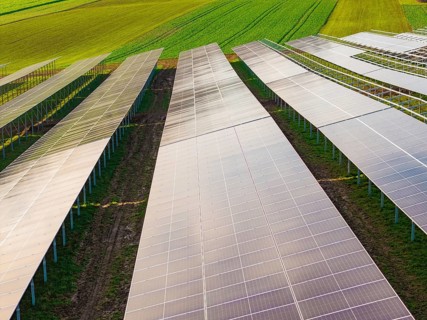 Close-up of solar systems spanning fields, energy transition, construction of PV open space,