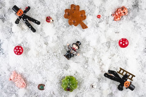 Various lucky charms and decorations on snow, New Year's Eve