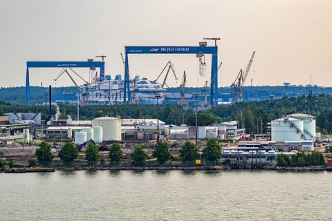 Industrial harbor scene with cranes and shipyards on the water, Meyer Werft, Turku, Finland