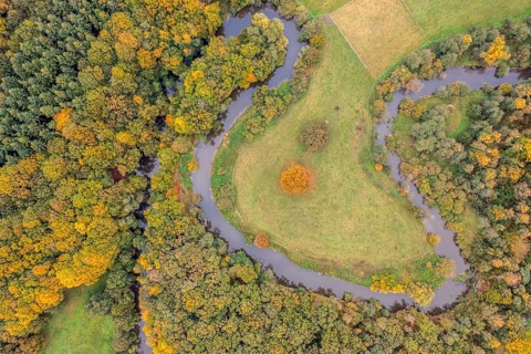Aerial view of the winding Hunte river in autumn landscape Aerial view Vertical aerial view,
