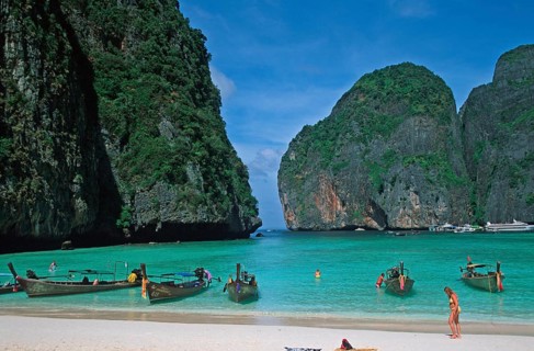 People, longtail boats on Maya Bay beach, known from the movie The Beach, one year in front of the