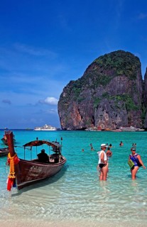 People, longtail boat on Maya Bay beach, known from the movie The Beach, one year in front of the