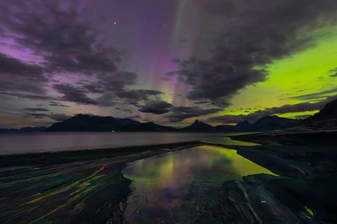 The Vestfjord in Nordland, Norway, has an enchanting atmosphere at night. Dark clouds and vivid