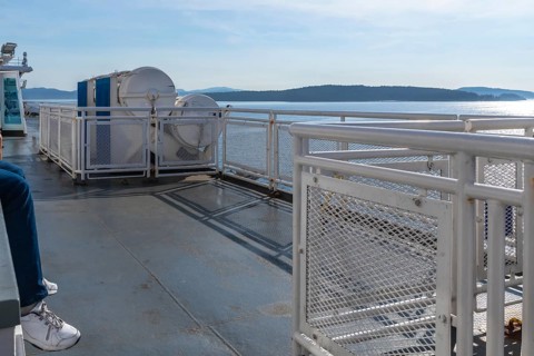 Passenger enjoying the scenic ferry ride from victoria, vancouver island, to vancouver, british