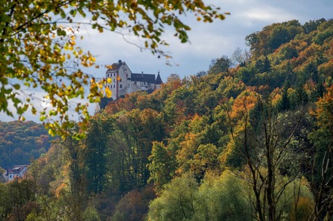 Egloffstein Castle with mixed autumn forest, Egloffstein, Upper Franconia, Bavaria, Germany