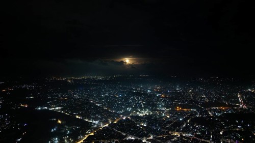 A Drone night view of Aleppo, Syria on December 19, 2025, showing illuminated streets, dense