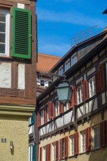 Typical old town scene, half-timbered houses, old street lamp, light, shutters, idyll, Tübingen,
