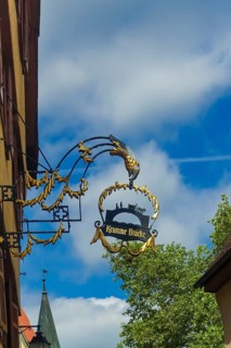 Tavern sign, crooked bridge, old restaurant sign, gold decoration, figurines, filigree advertising